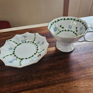 butterfly footed light green floral teacup and saucer with gold rim meritage